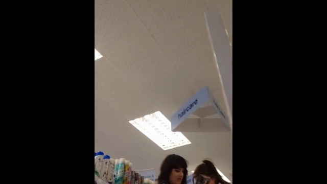 Goth teen upskirt in store