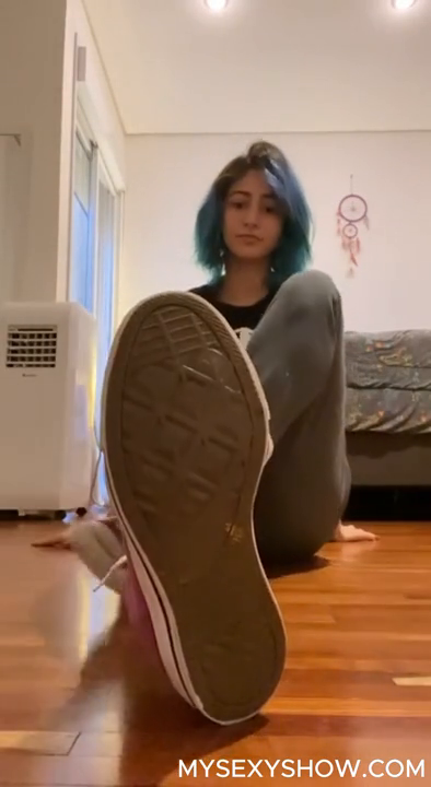 Emo girl gets off her shoes and socks showing feet